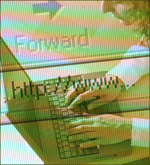 Image of woman typing on computer.